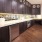 a common area kitchen with marble countertops