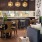 a lounge with various seating and a kitchenette