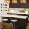 a kitchen island with a marble countertop and barstools