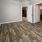 a bedroom with a wood floor and a ceiling fan