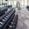 a gym with dumbells and treadmills